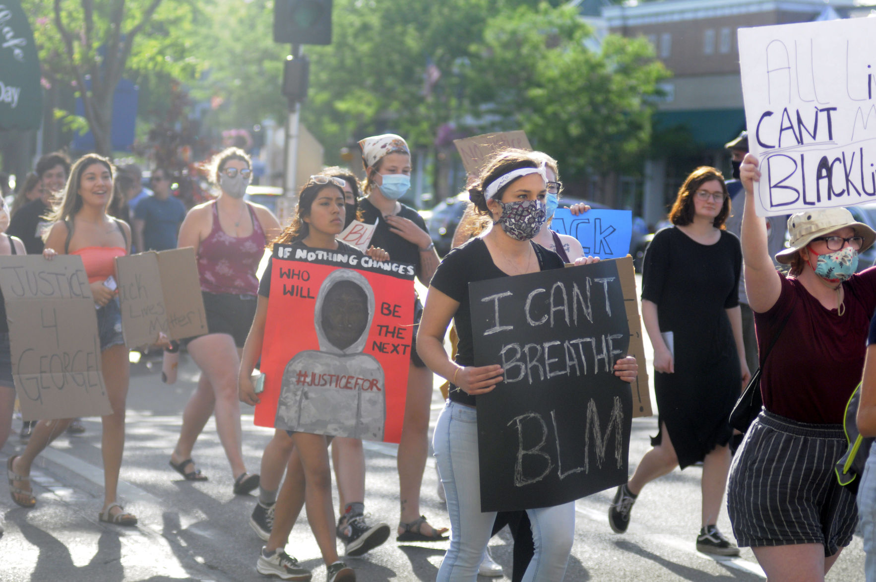Protesters cross Broad Street